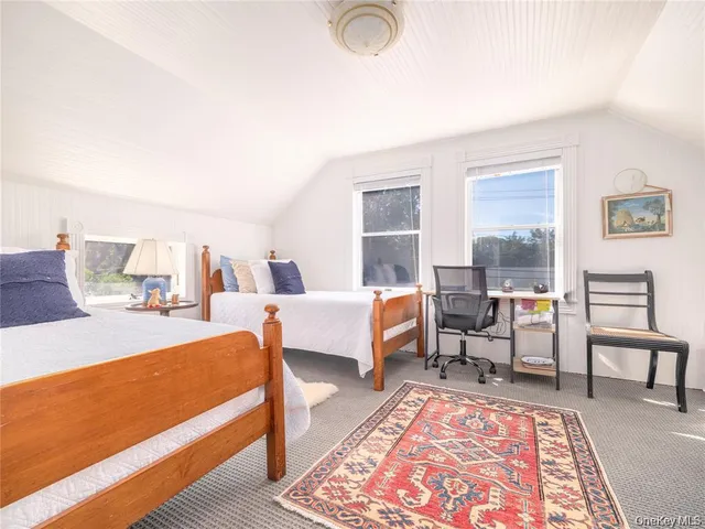 a living room with furniture lamp and rug