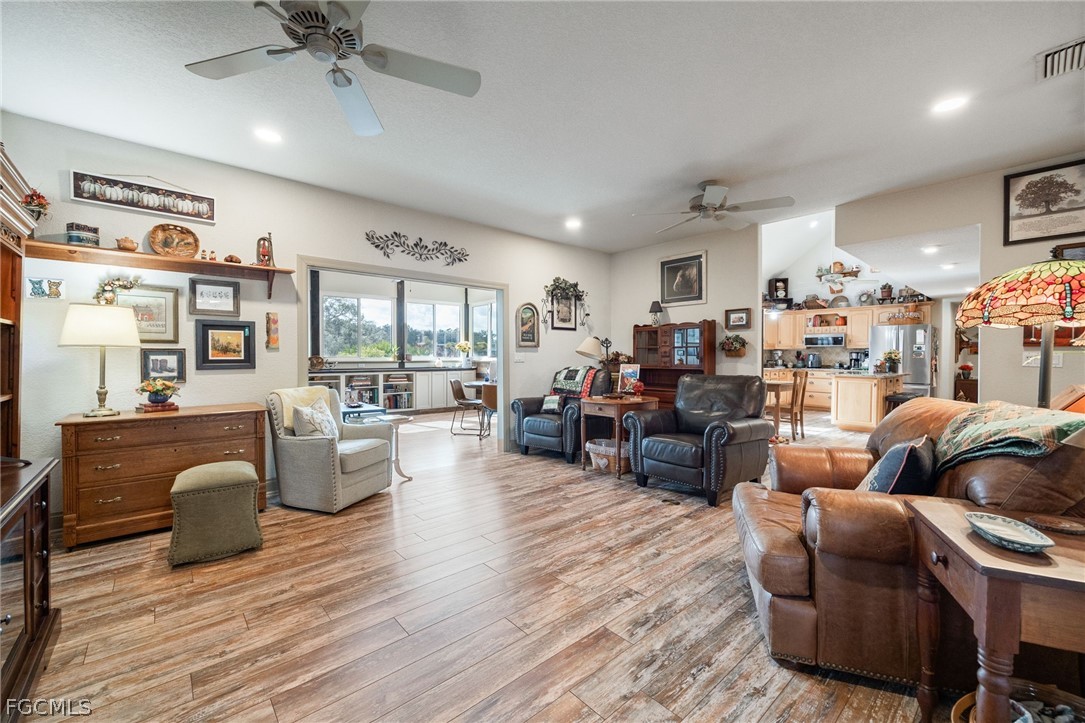 22800 North River Road Alva, FL 33920 - Photo 14 of 50 a living room with furniture and a large window