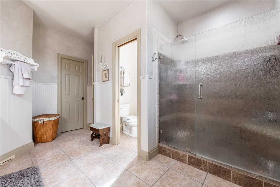 22800 North River Road Alva, FL 33920 - Photo 20 of 50 a bathroom with a shower and a sink