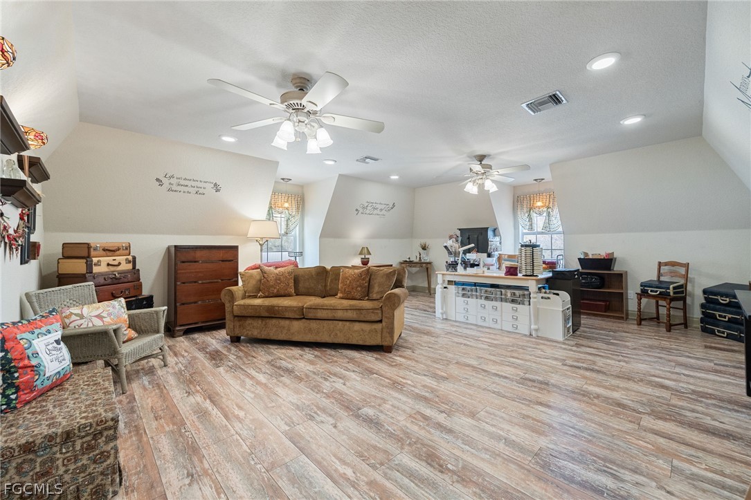 22800 North River Road Alva, FL 33920 - Photo 23 of 50 a living room with furniture and kitchen view