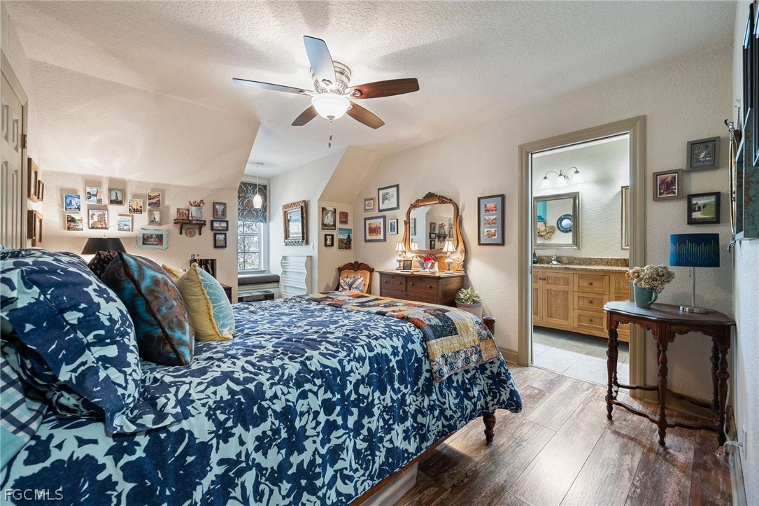 22800 North River Road Alva, FL 33920 - Photo 25 of 50 a bed room with a bed window and a chair