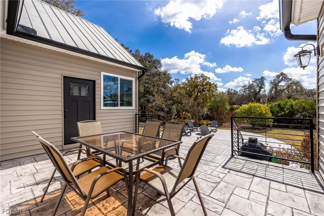 22800 North River Road Alva, FL 33920 - Photo 31 of 50 a view of a chairs and tables in the patio