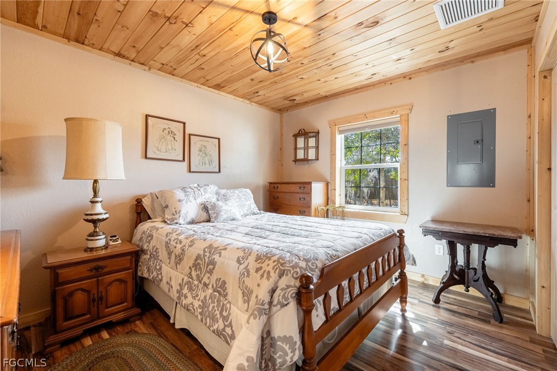 22800 North River Road Alva, FL 33920 - Photo 41 of 50 a bedroom with bed and wooden floor