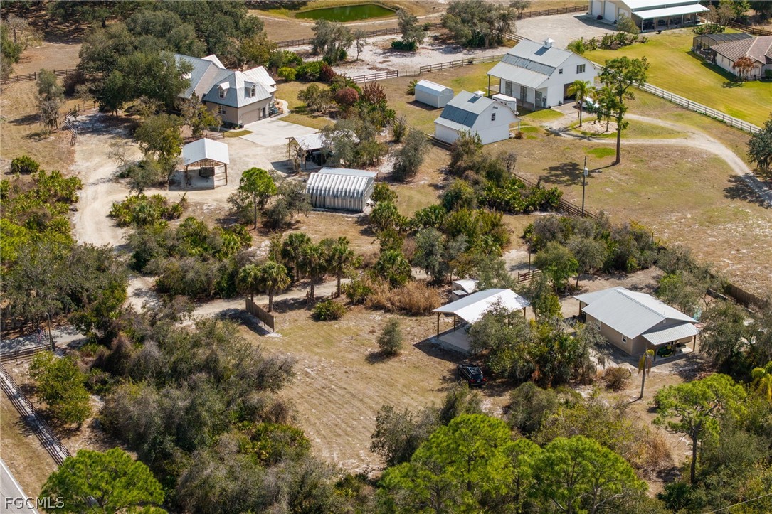 22800 North River Road Alva, FL 33920 - Photo 47 of 50 an aerial view of residential houses with outdoor space and trees