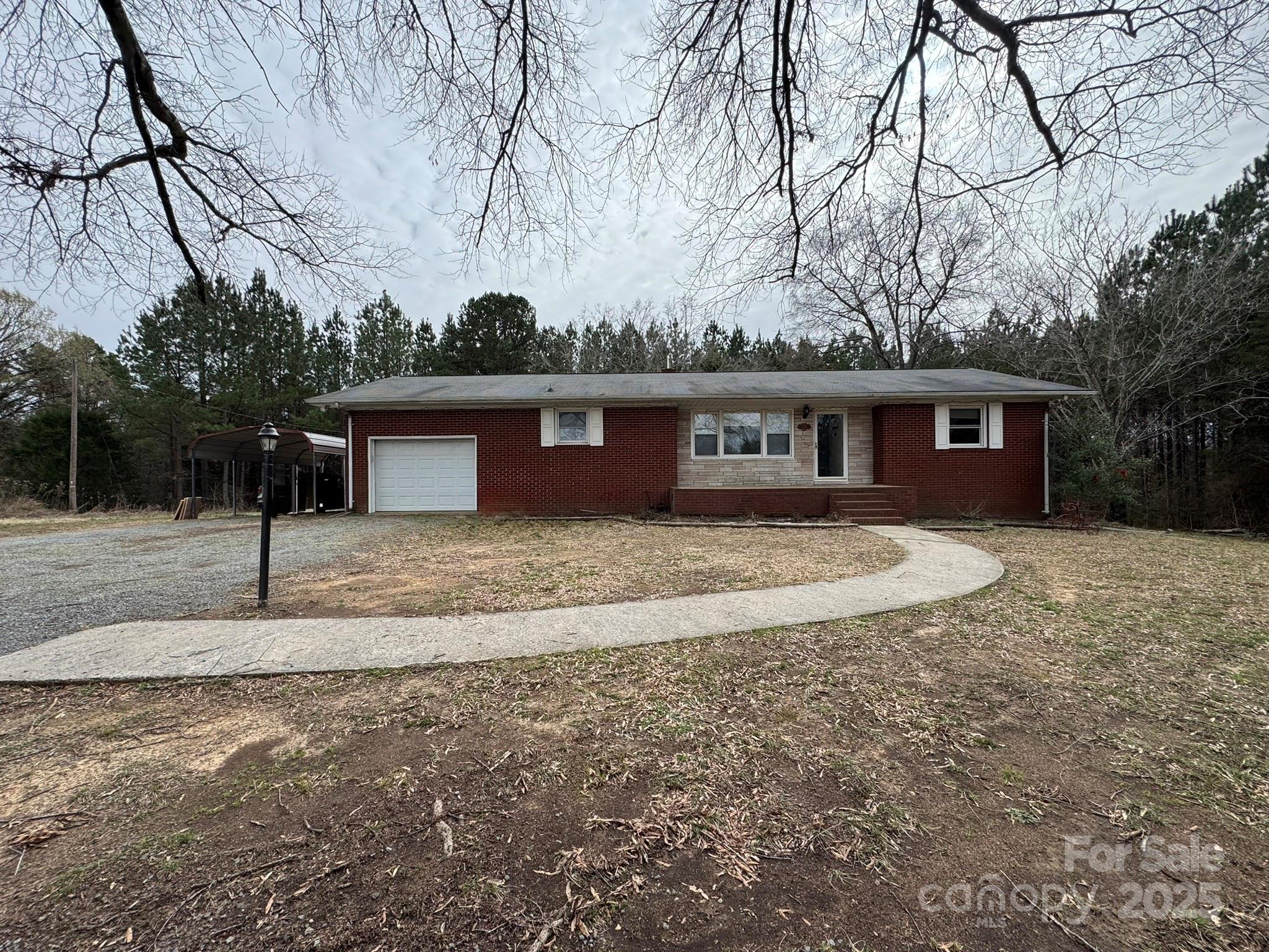 a view of house with a yard
