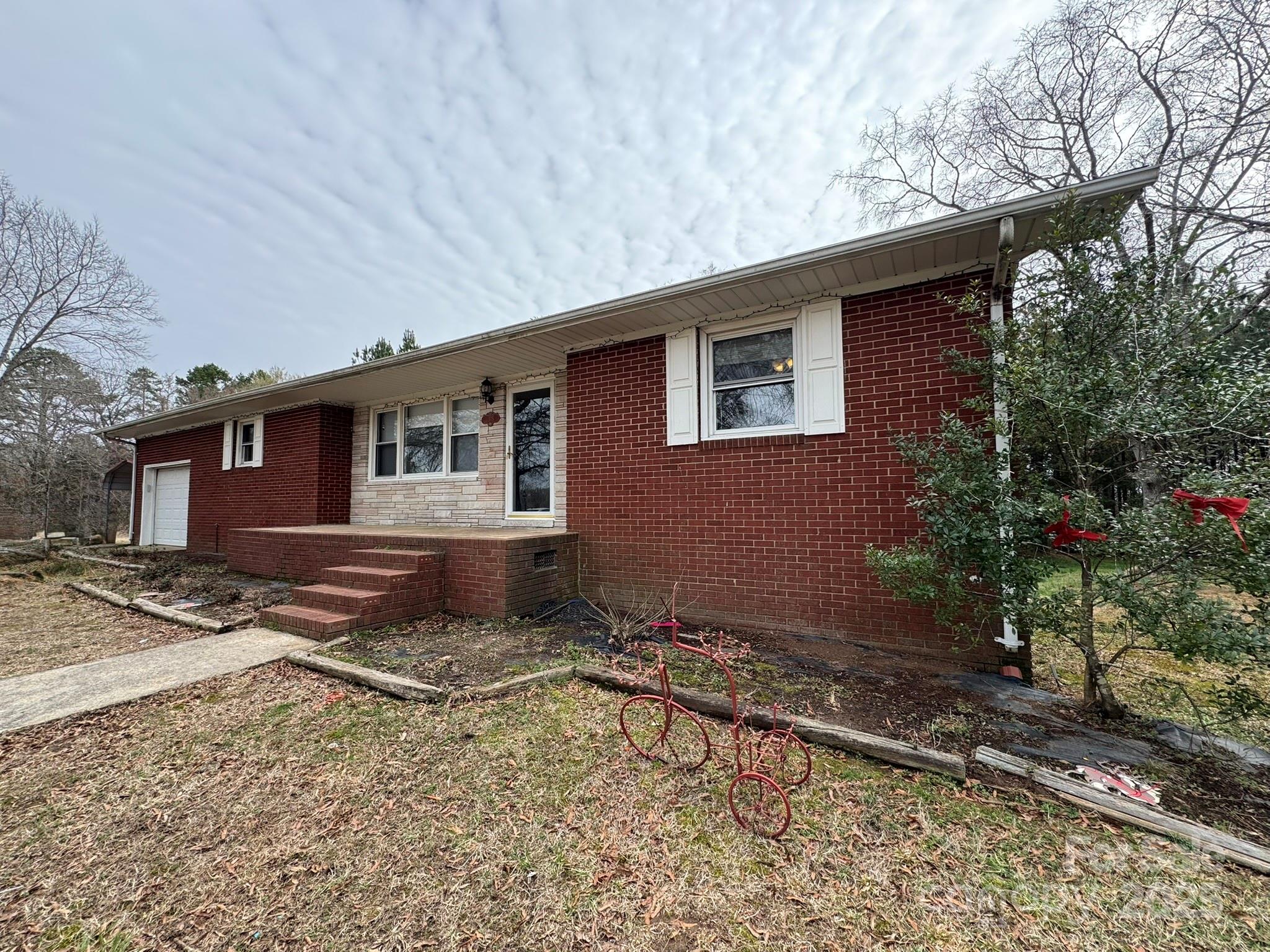 1575 Simplicity Road Concord, NC 28025 - Photo 2 of 23 a front view of a house with a yard