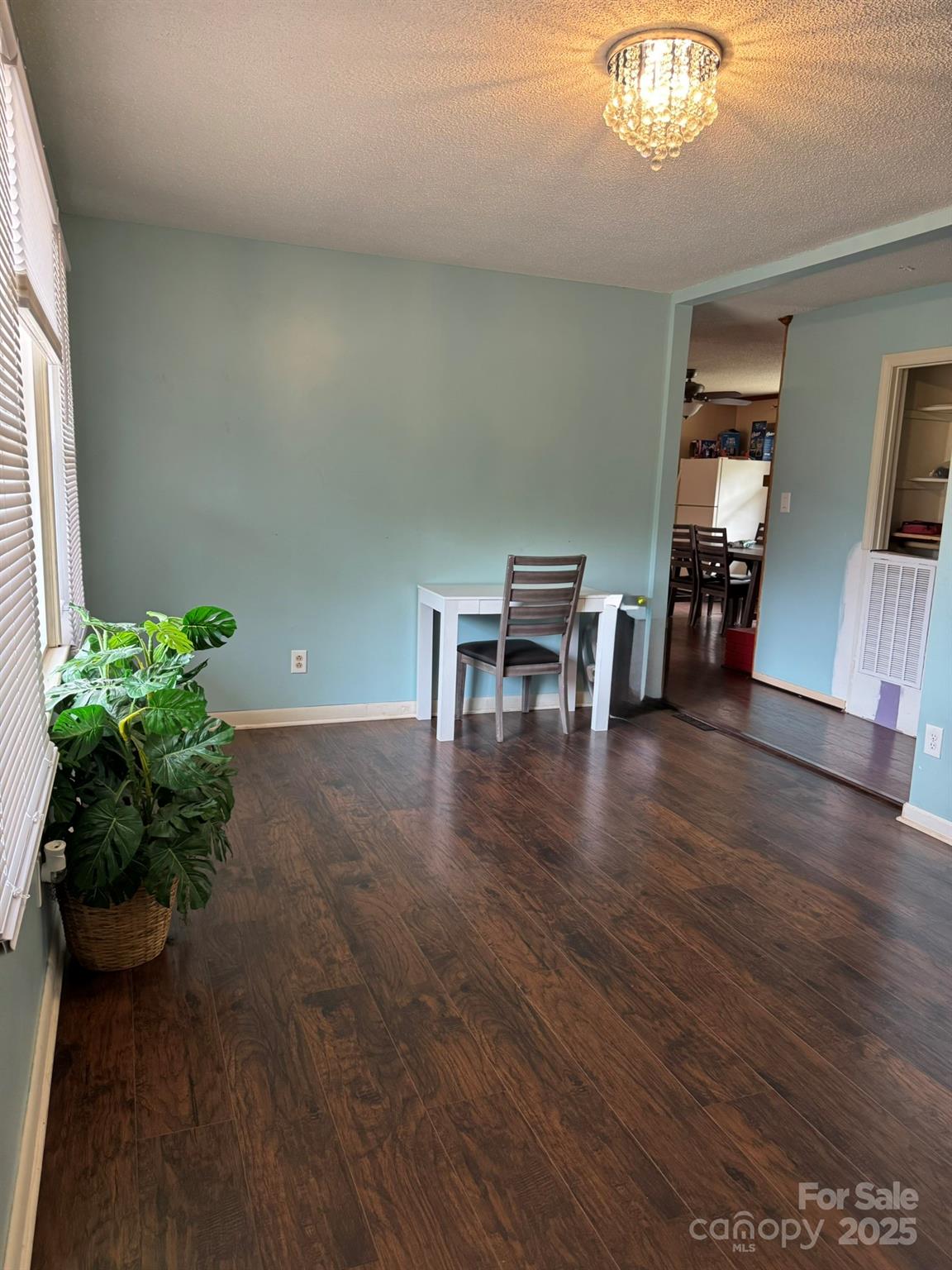 1575 Simplicity Road Concord, NC 28025 - Photo 9 of 23 a view of a dining room with furniture and wooden floor