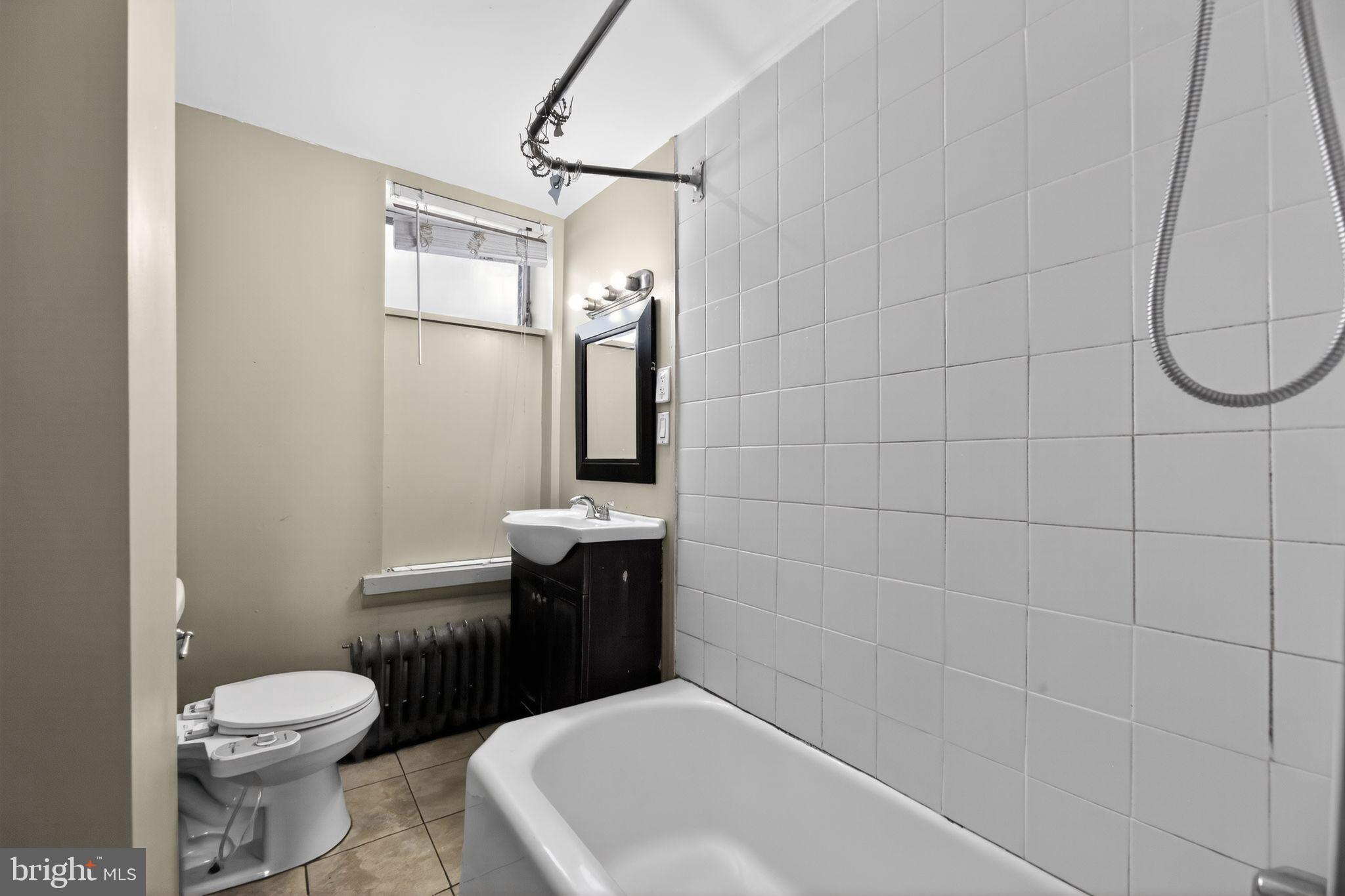 315 Fitzgerald Street Philadelphia, PA 19148 - Photo 5 of 15 a bathroom with a toilet sink and shower