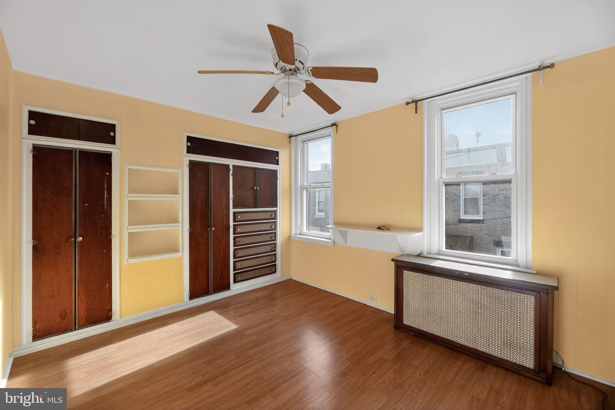 315 Fitzgerald Street Philadelphia, PA 19148 - Photo 8 of 15 a view of a livingroom with wooden floor and a ceiling fan