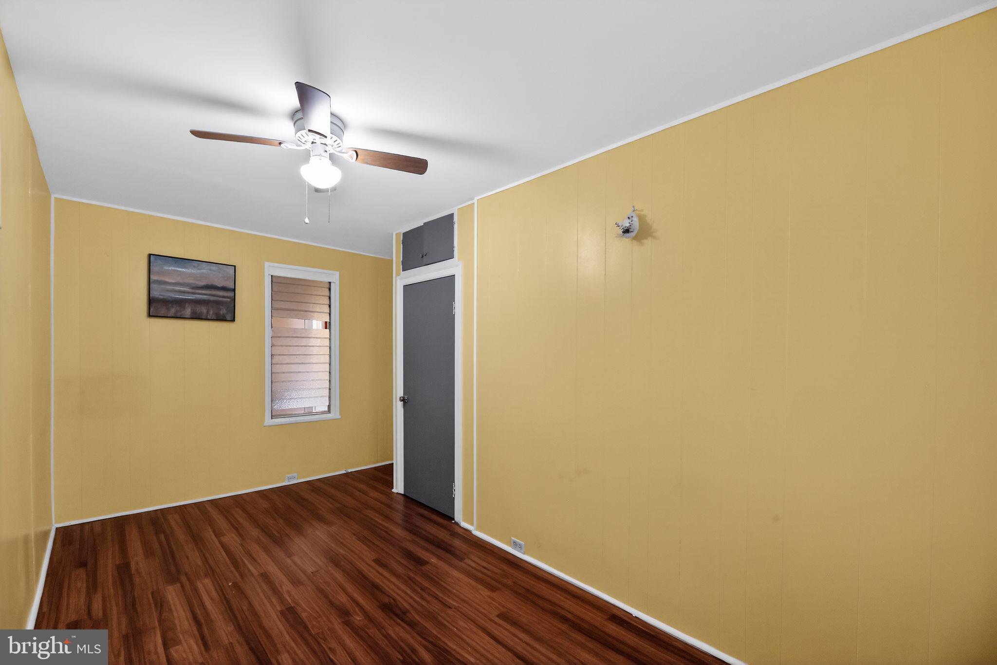 315 Fitzgerald Street Philadelphia, PA 19148 - Photo 10 of 15 a view of an empty room with wooden floor and a window