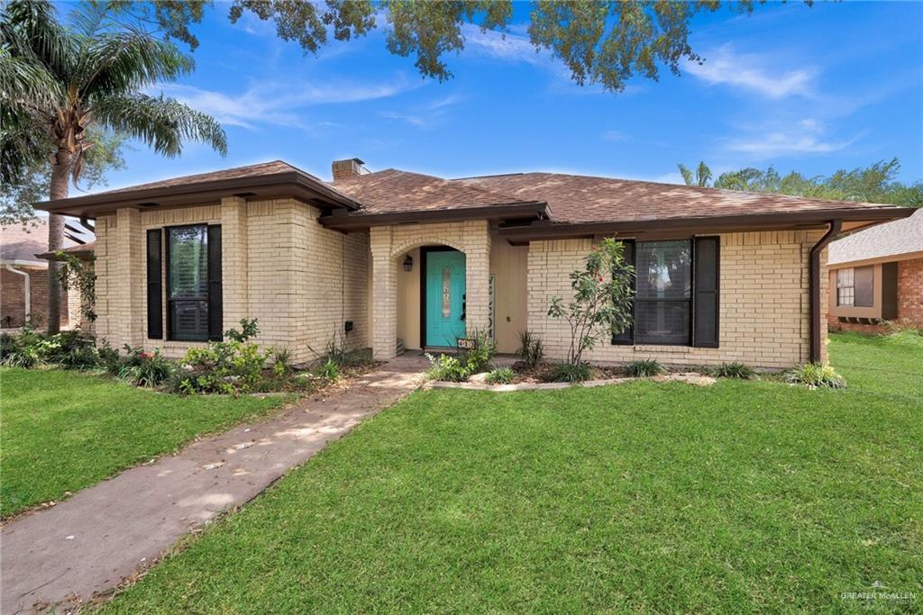 413 Xanthisma Avenue McAllen, TX 78504 - Photo 1 of 1 a front view of a house with a garden and yard