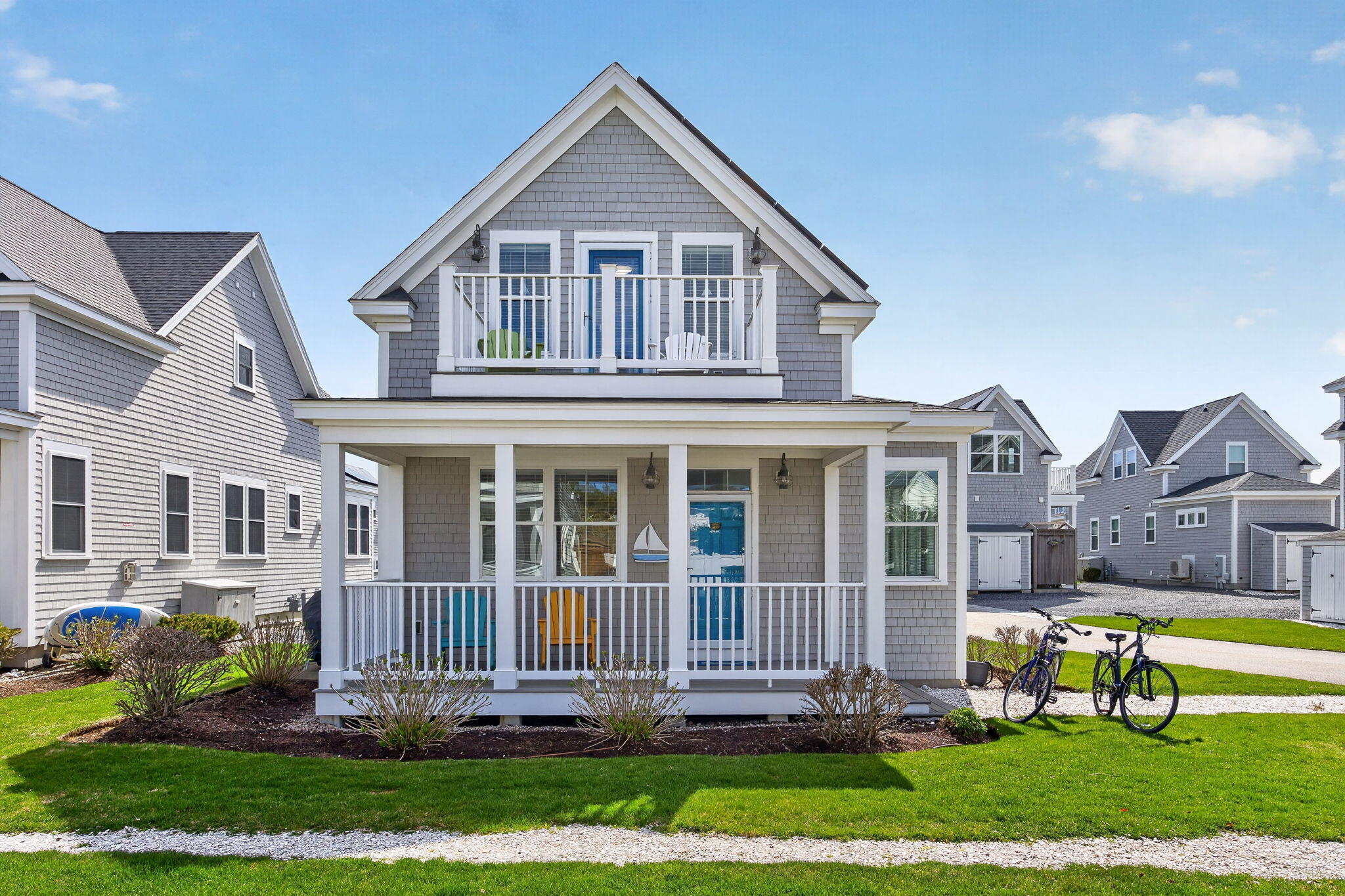 61 Old Wharf Road, Unit 62 Dennis Port, MA 02639 - Photo 1 of 45 a view of a house with a yard and plants