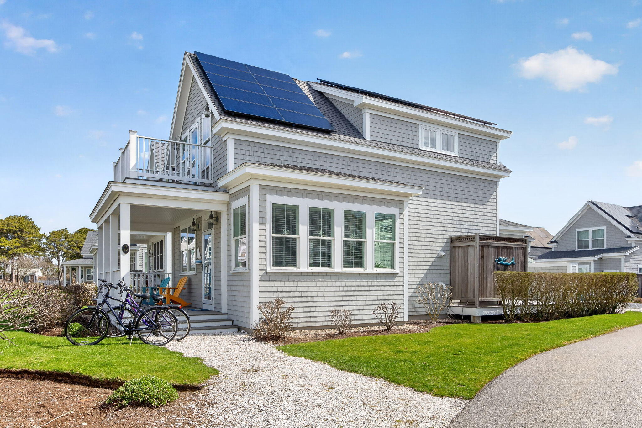 61 Old Wharf Road, Unit 62 Dennis Port, MA 02639 - Photo 2 of 45 a view of a house with a yard