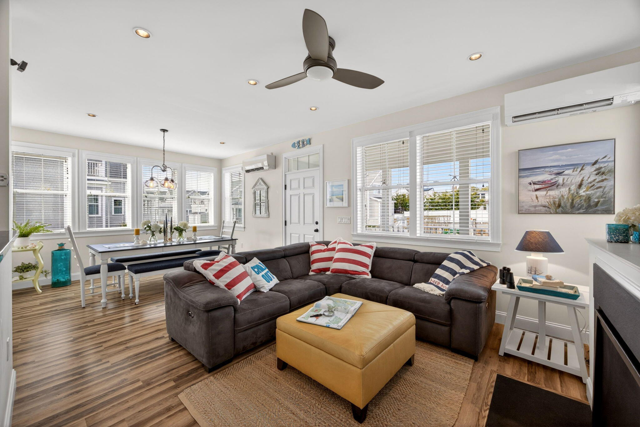61 Old Wharf Road, Unit 62 Dennis Port, MA 02639 - Photo 20 of 45 a living room with furniture and a large window