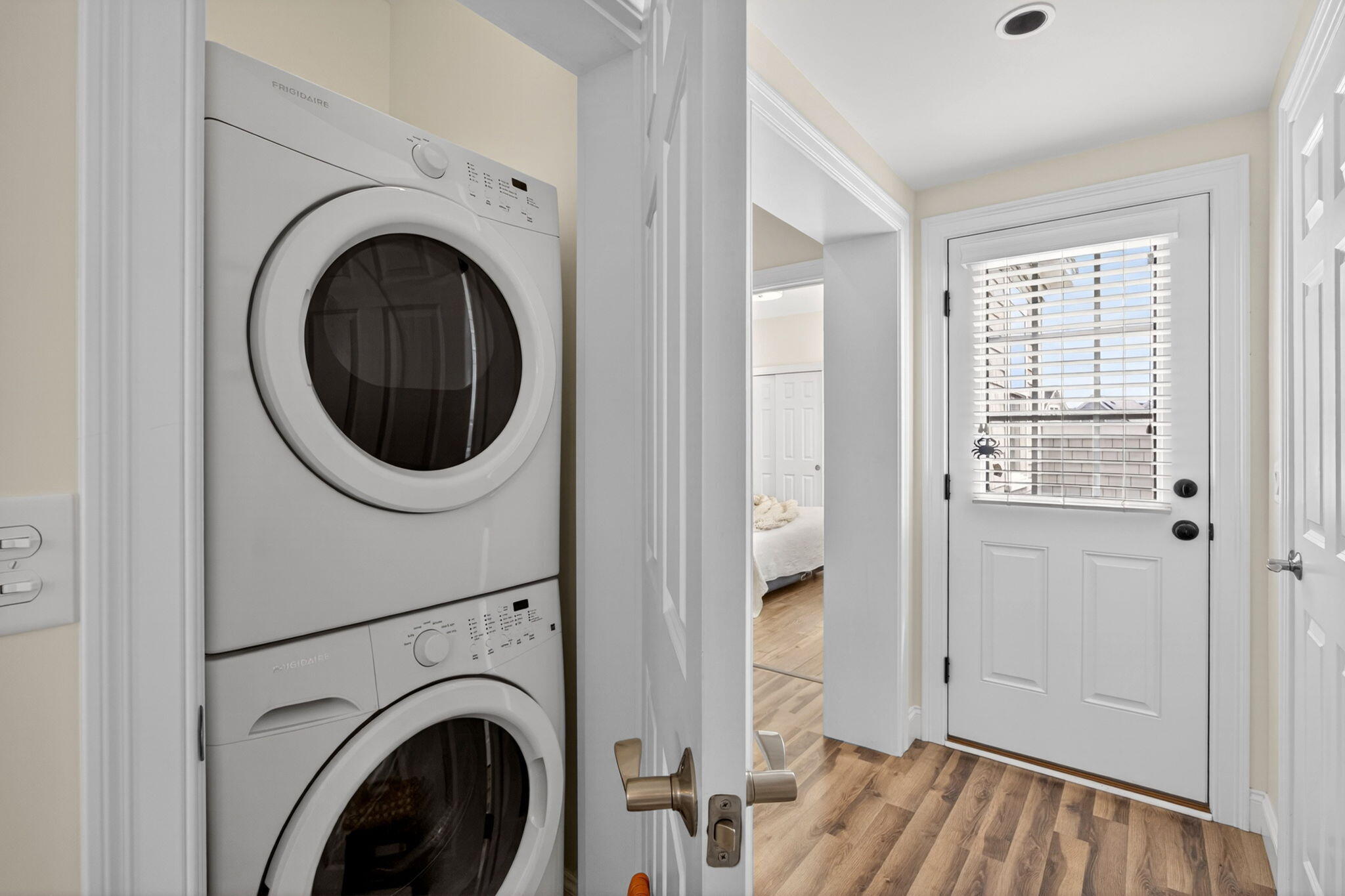 61 Old Wharf Road, Unit 62 Dennis Port, MA 02639 - Photo 24 of 45 a view of a hallway with washer and dryer