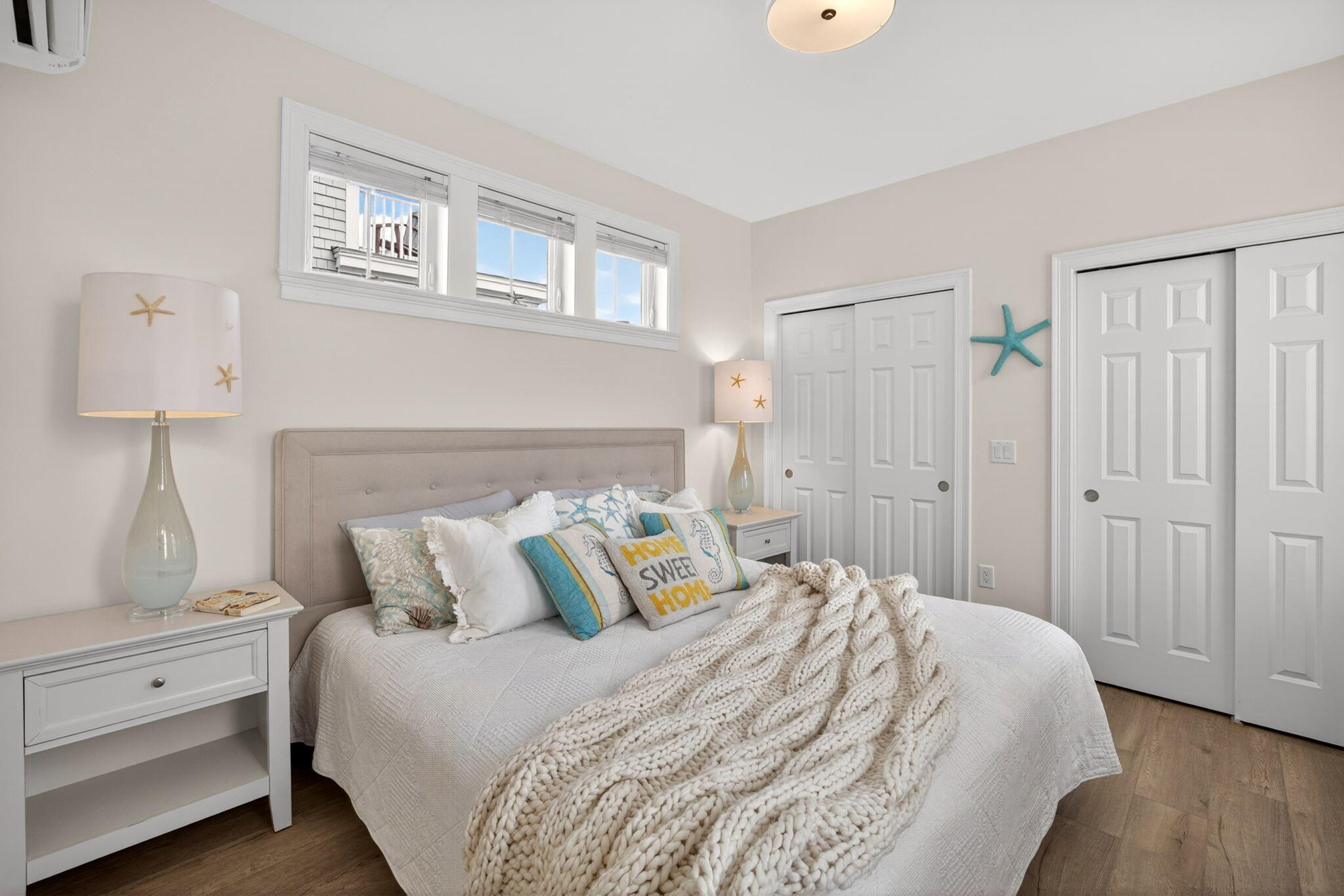 61 Old Wharf Road, Unit 62 Dennis Port, MA 02639 - Photo 25 of 45 a bedroom with a bed and a night stand