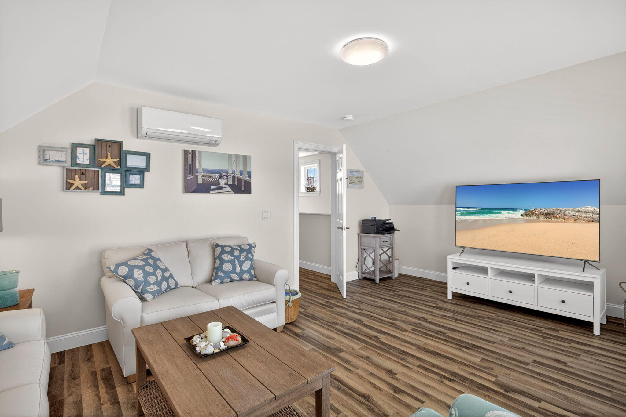 61 Old Wharf Road, Unit 62 Dennis Port, MA 02639 - Photo 30 of 45 a living room with furniture and a flat screen tv
