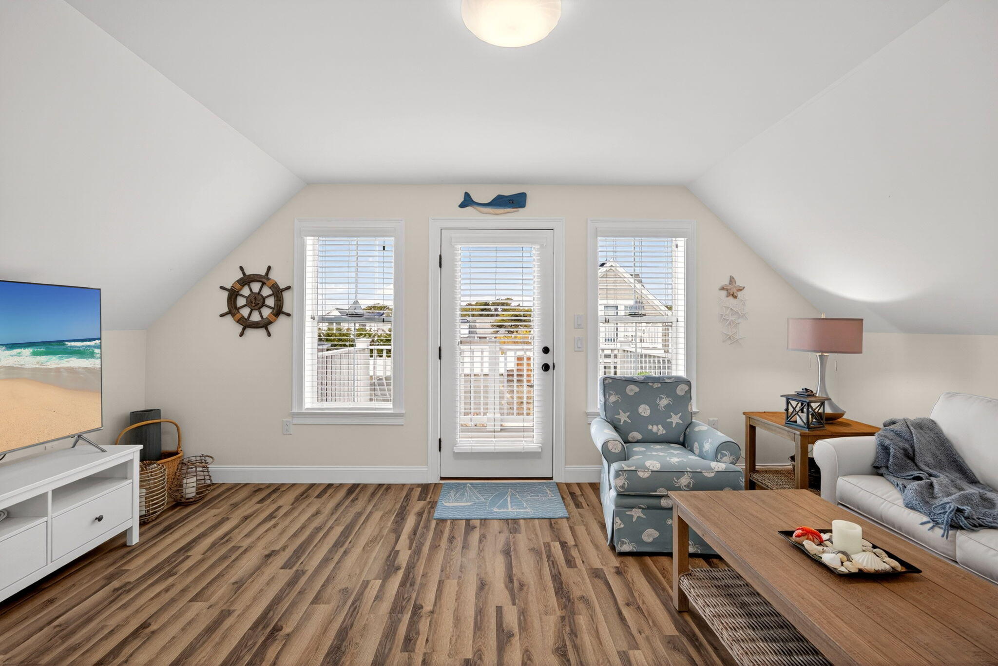 61 Old Wharf Road, Unit 62 Dennis Port, MA 02639 - Photo 31 of 45 a living room with furniture and a window