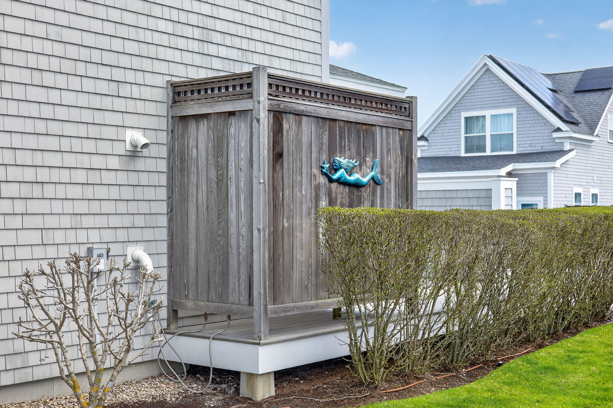 61 Old Wharf Road, Unit 62 Dennis Port, MA 02639 - Photo 36 of 45 a front view of a house with plants