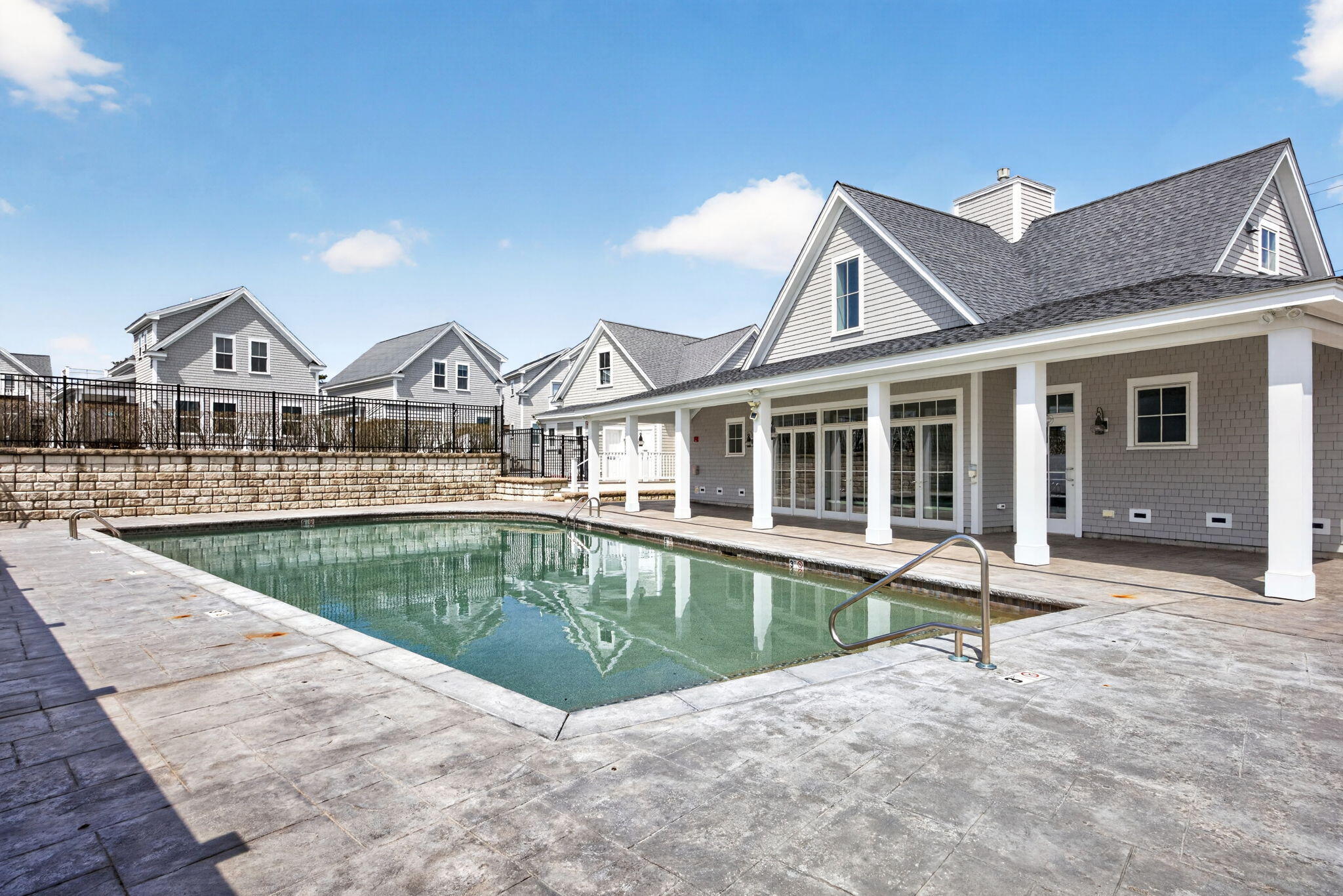 61 Old Wharf Road, Unit 62 Dennis Port, MA 02639 - Photo 37 of 45 a view of a house with pool and chairs