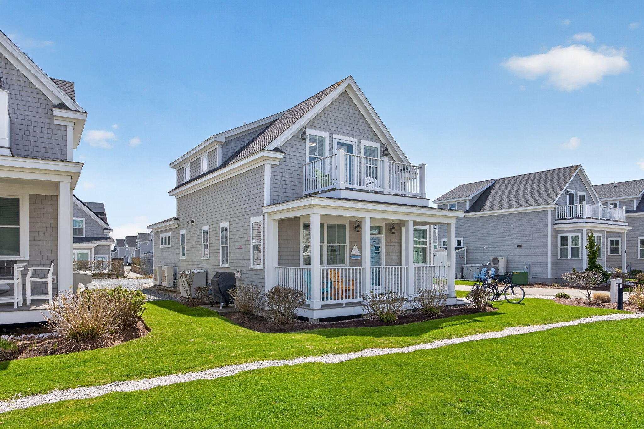 61 Old Wharf Road, Unit 62 Dennis Port, MA 02639 - Photo 4 of 45 a view of a house with a yard porch and sitting area