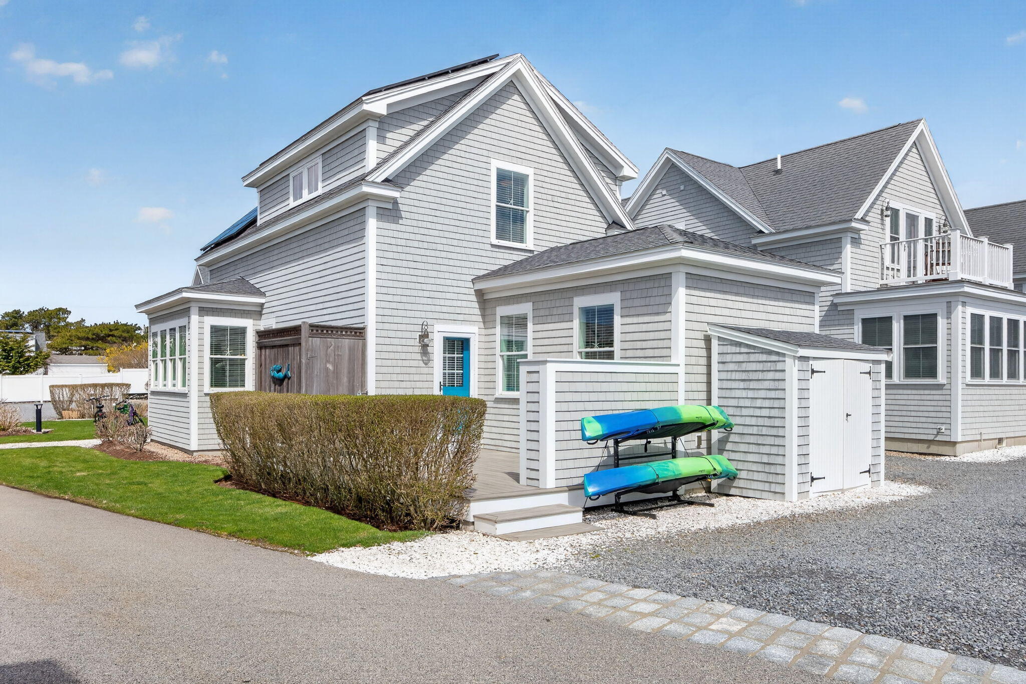 61 Old Wharf Road, Unit 62 Dennis Port, MA 02639 - Photo 5 of 45 a view of a house with a yard and a large space