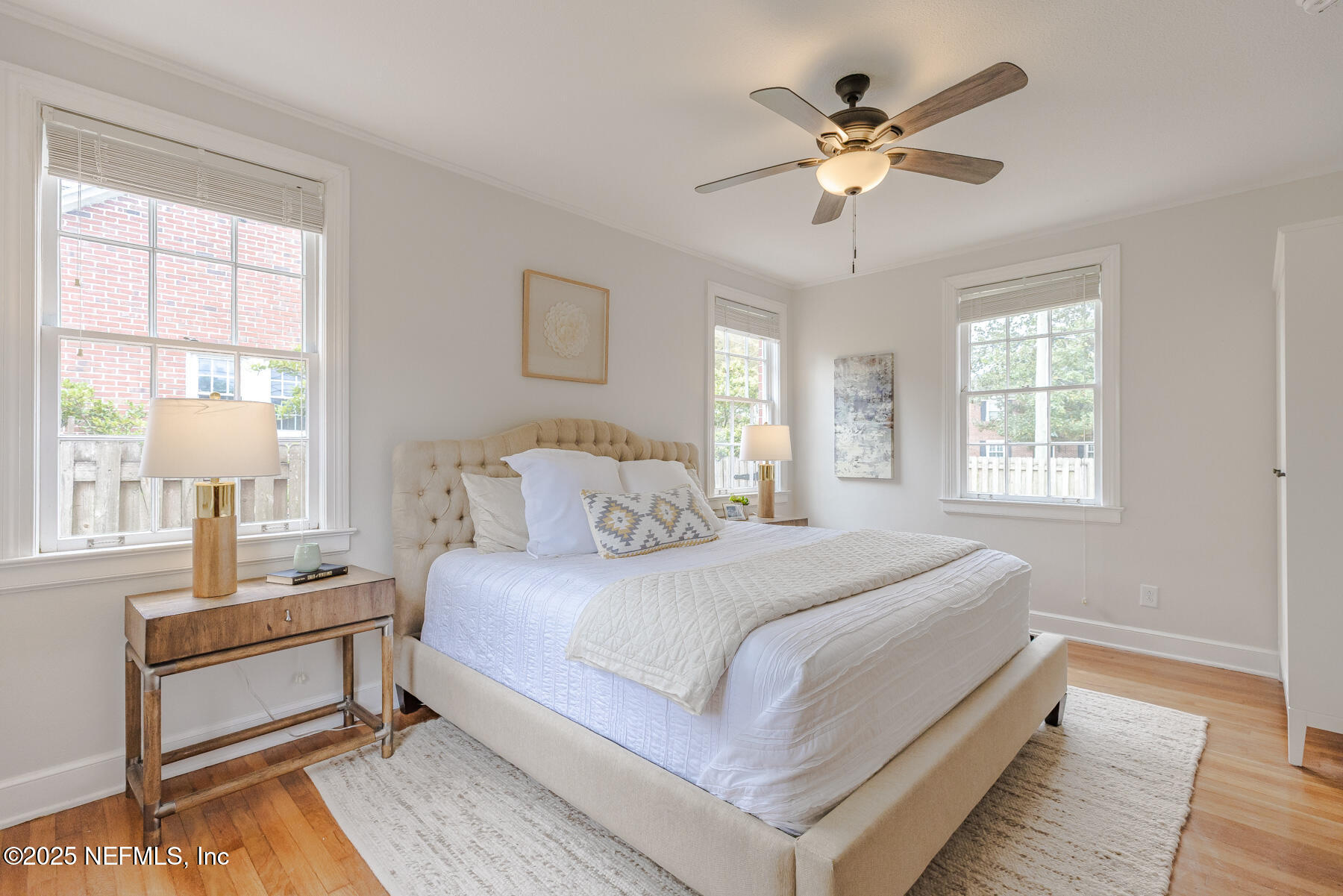 2545 Hendricks Avenue Jacksonville, FL 32207 - Photo 25 of 45 a bedroom with a large bed and a chandelier