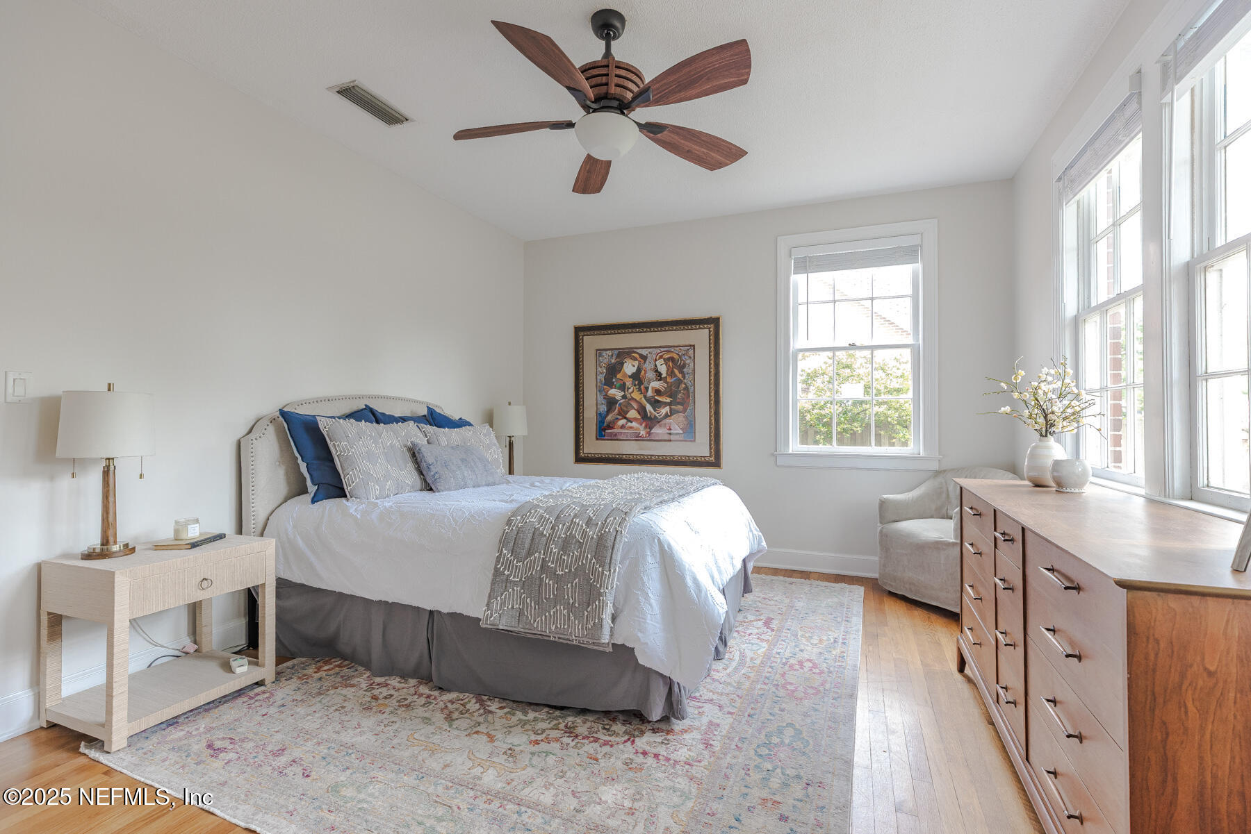 2545 Hendricks Avenue Jacksonville, FL 32207 - Photo 30 of 45 a spacious bedroom with a bed a chandelier and a window