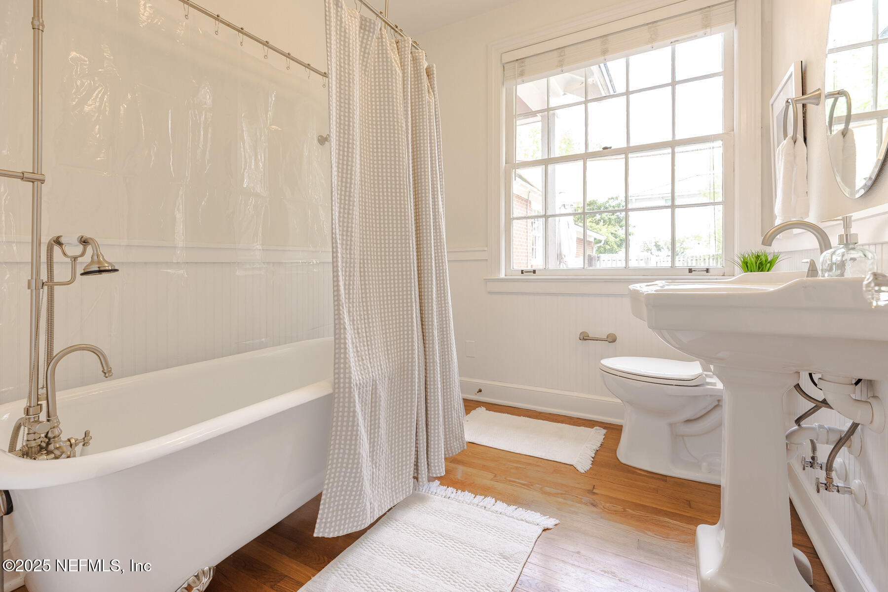 2545 Hendricks Avenue Jacksonville, FL 32207 - Photo 31 of 45 a bathroom with a sink a bathtub and a window