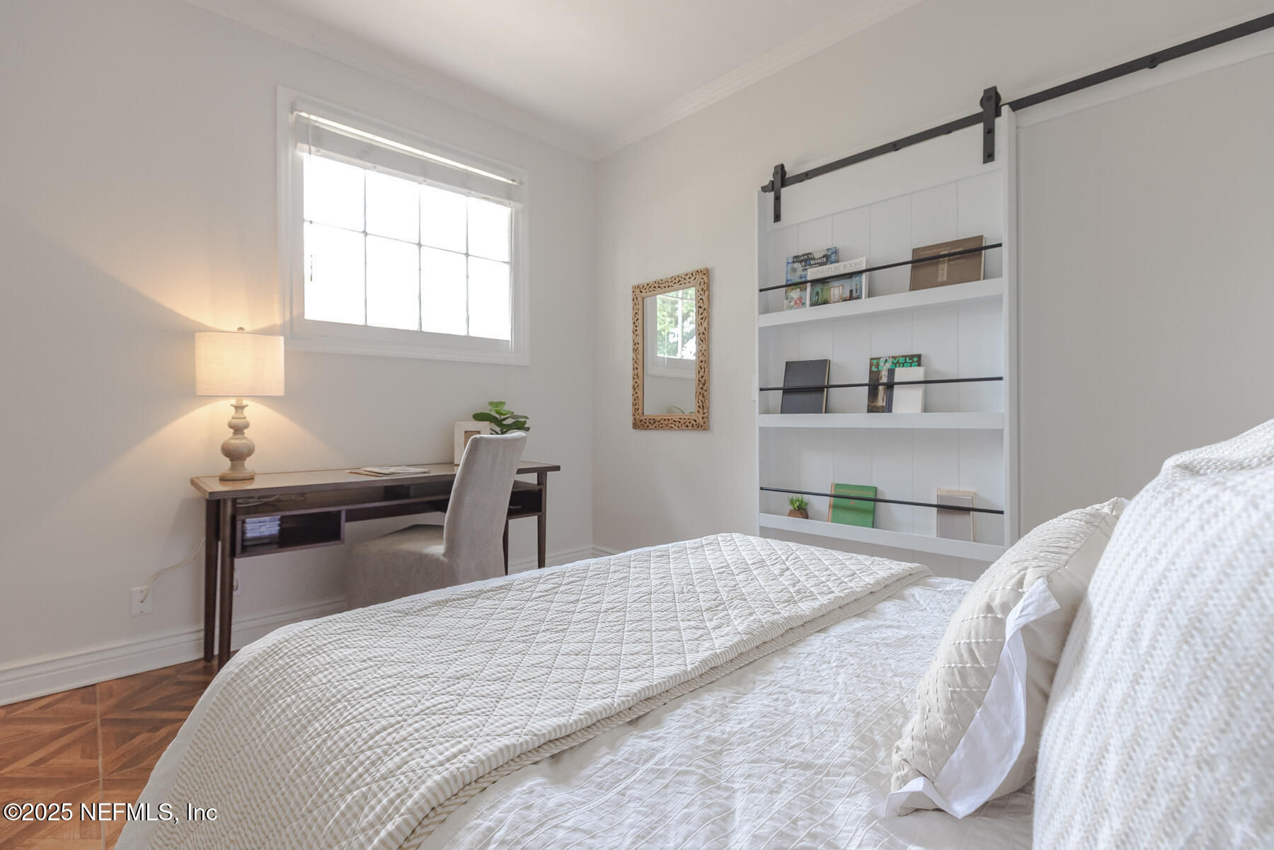 2545 Hendricks Avenue Jacksonville, FL 32207 - Photo 34 of 45 a bedroom with a bed and a table