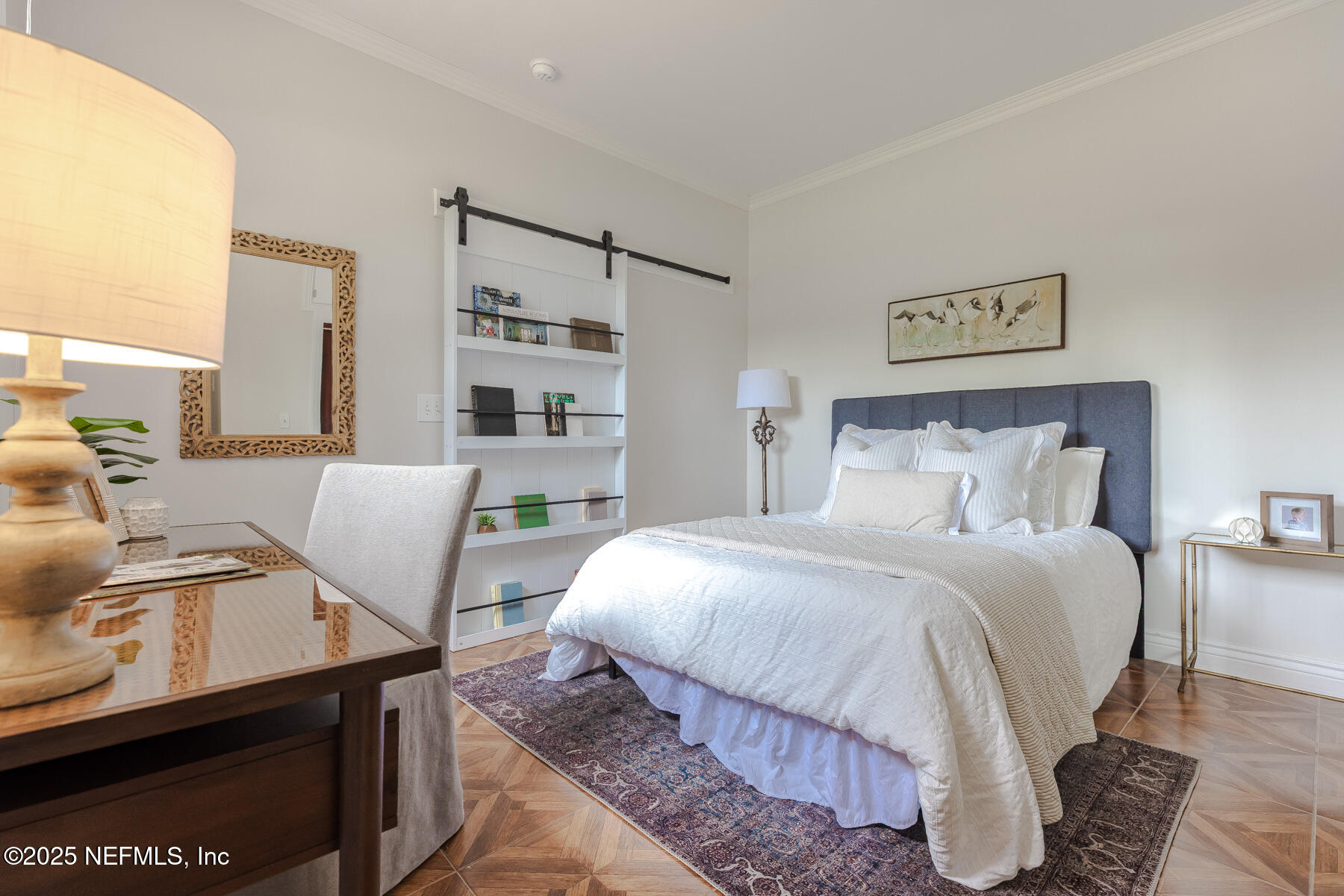 2545 Hendricks Avenue Jacksonville, FL 32207 - Photo 35 of 45 a bedroom with a bed and wooden floor