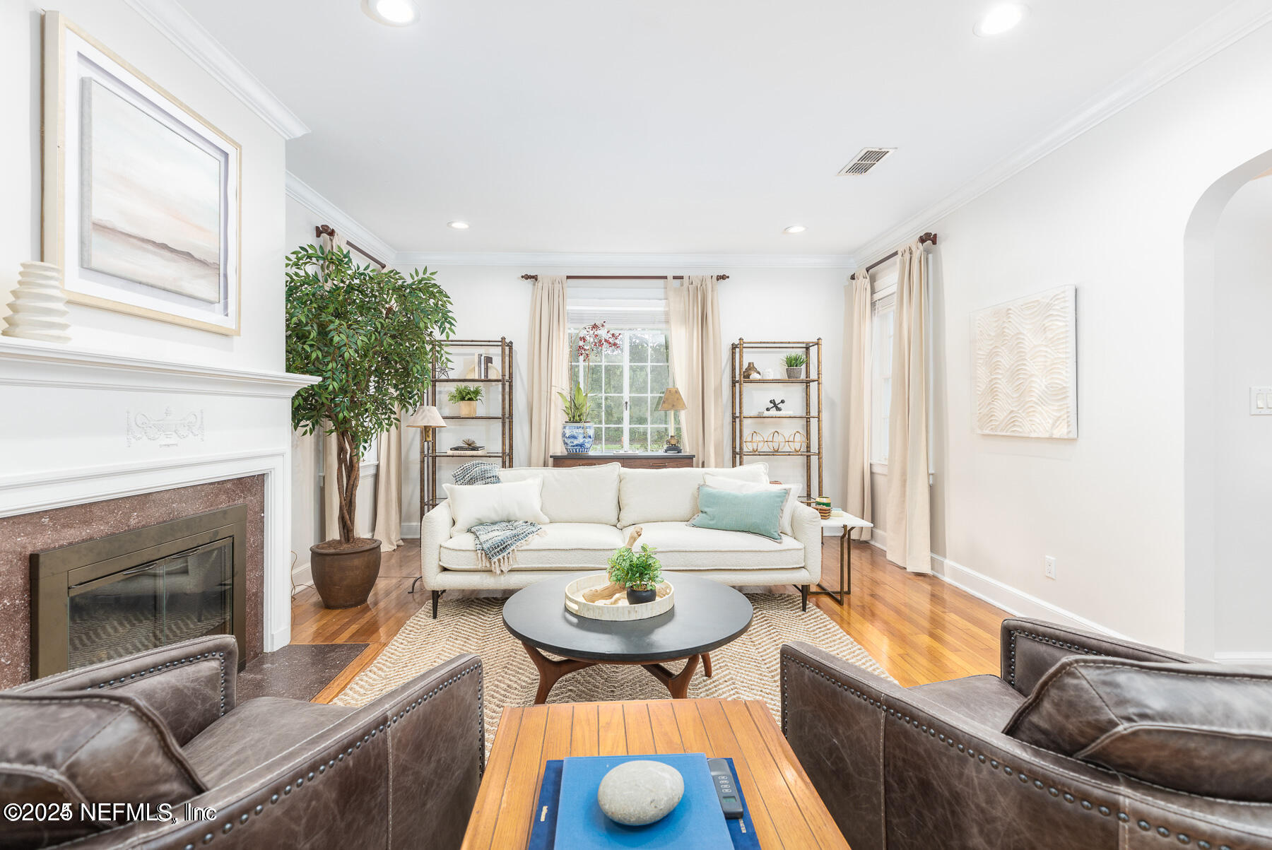 2545 Hendricks Avenue Jacksonville, FL 32207 - Photo 7 of 45 a living room with furniture and a fireplace