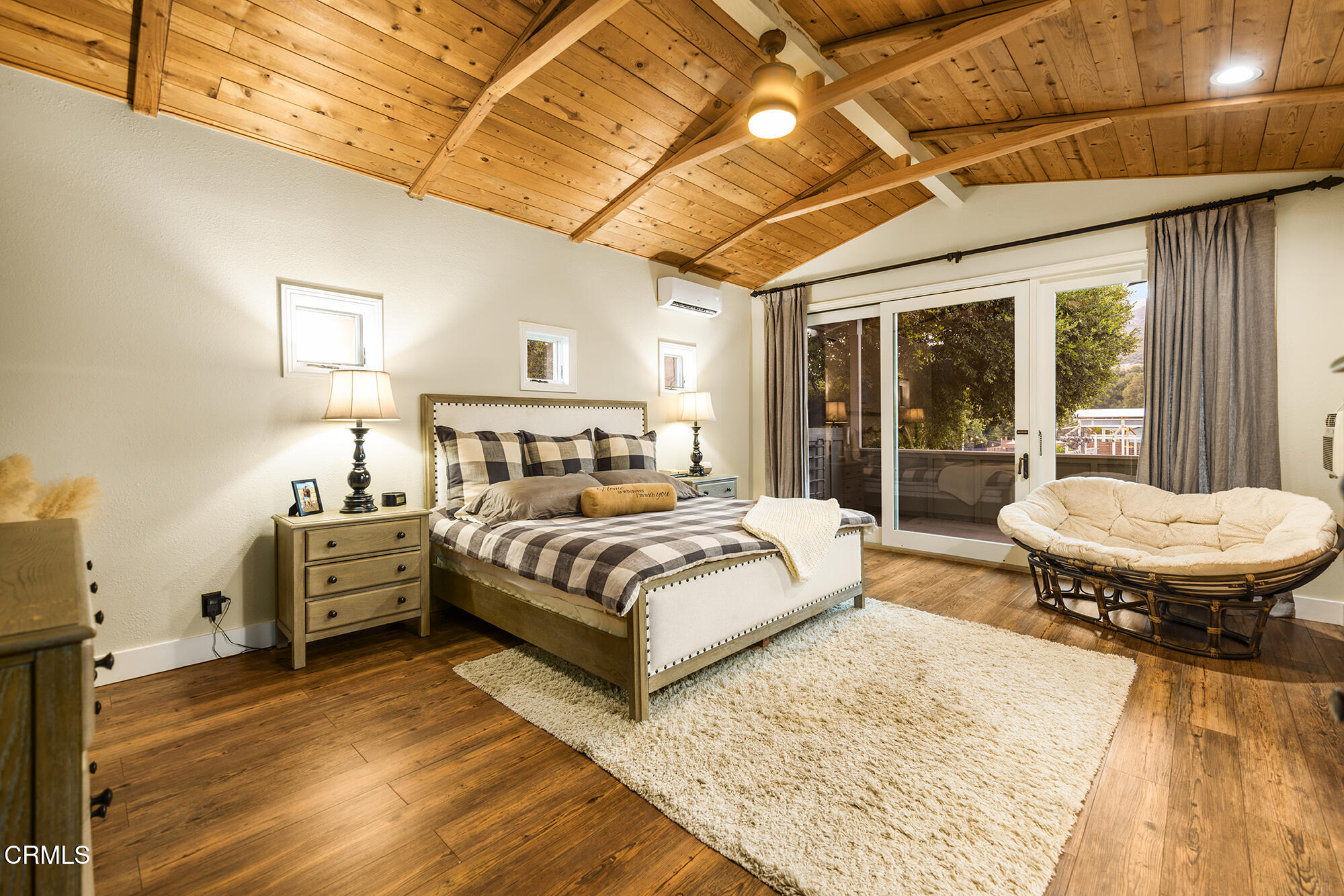 12475 Christmas Tree Road Ojai, CA 93023 - Photo 21 of 50 a bedroom with a bed and wooden floor