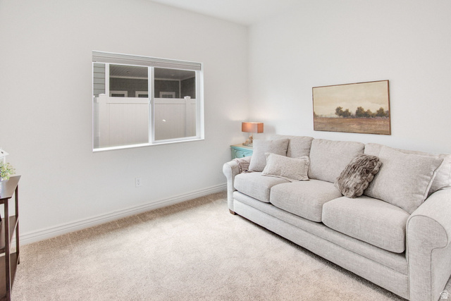 910 South 1700 West Layton, UT 84041 - Photo 17 of 26 Carpeted living room with baseboards