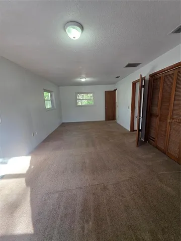 a bathroom with a toilet sink and shower
