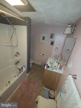 a bathroom with a bathtub and shower