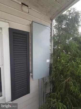 a view of a door and tree