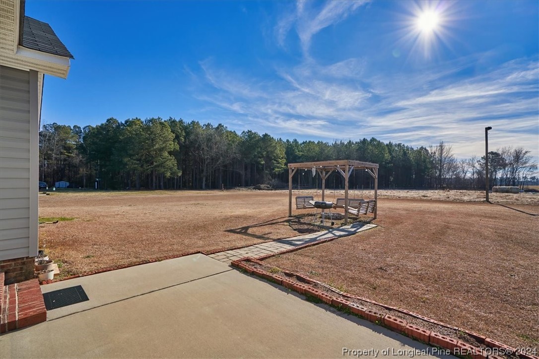 623 Hammonds Road Lumberton, NC 28360 - Photo 11 of 39 a view of a house with a yard