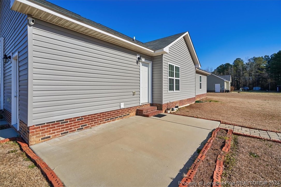 623 Hammonds Road Lumberton, NC 28360 - Photo 12 of 39 a view of a house with a roof deck