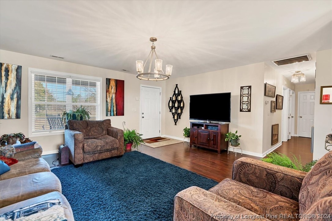 623 Hammonds Road Lumberton, NC 28360 - Photo 16 of 39 a living room with furniture and a flat screen tv