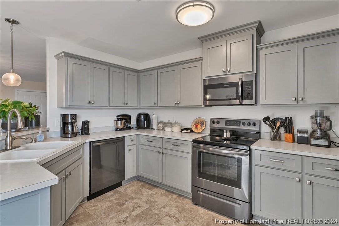 623 Hammonds Road Lumberton, NC 28360 - Photo 21 of 39 a kitchen with cabinets stainless steel appliances and a sink