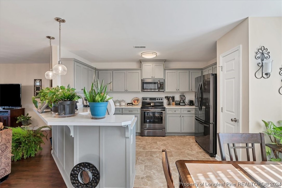 623 Hammonds Road Lumberton, NC 28360 - Photo 26 of 39 a kitchen with a refrigerator sink and cabinets