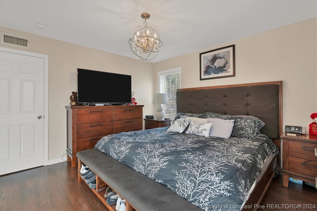 623 Hammonds Road Lumberton, NC 28360 - Photo 28 of 39 a bedroom with a bed and a flat screen tv