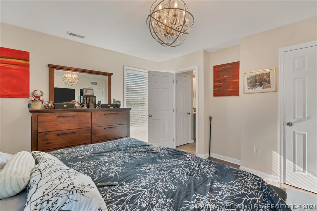 623 Hammonds Road Lumberton, NC 28360 - Photo 29 of 39 a bedroom with a bed and a dresser in it