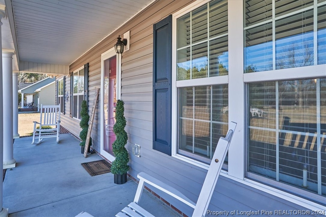 623 Hammonds Road Lumberton, NC 28360 - Photo 3 of 39 a view of front door and porch with seating space