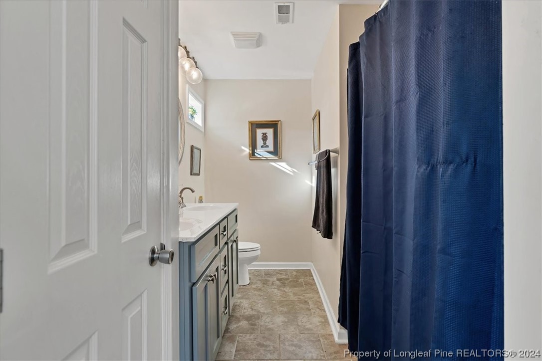 623 Hammonds Road Lumberton, NC 28360 - Photo 31 of 39 a kitchen with a refrigerator and a stove