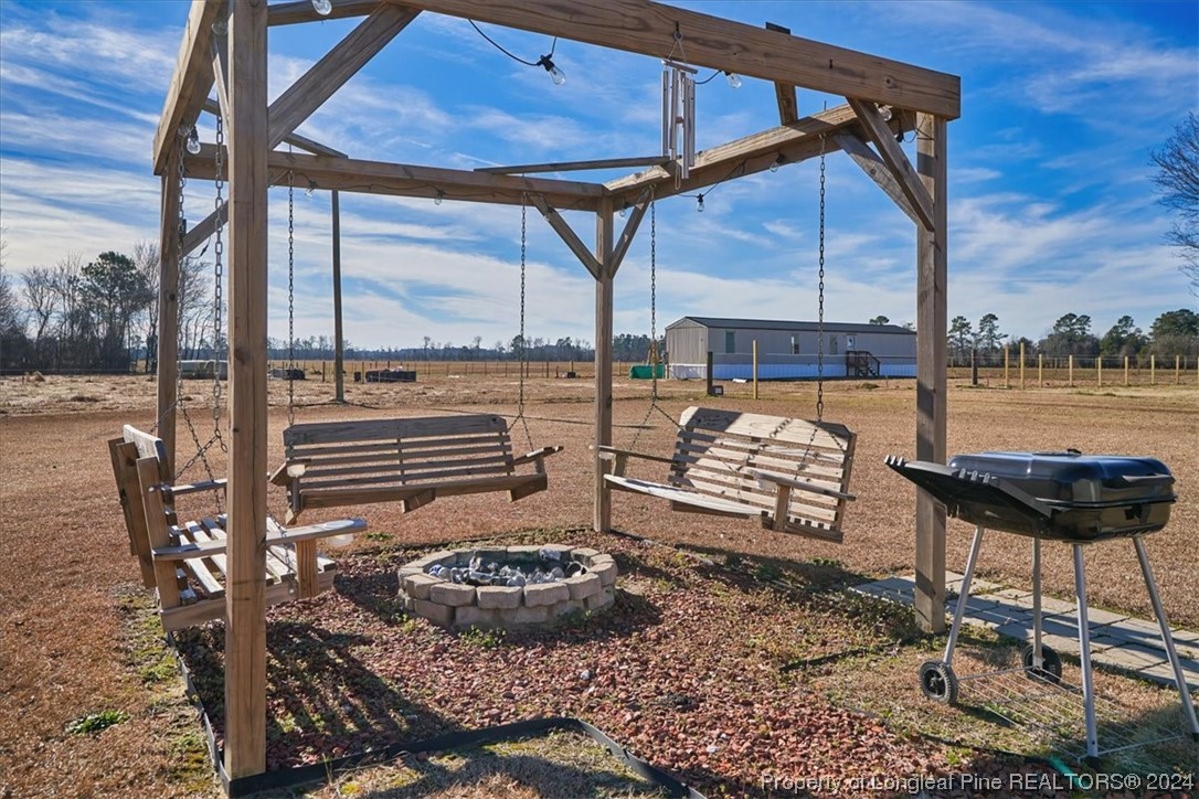 623 Hammonds Road Lumberton, NC 28360 - Photo 9 of 39 a view of a swimming pool with a lounge chairs