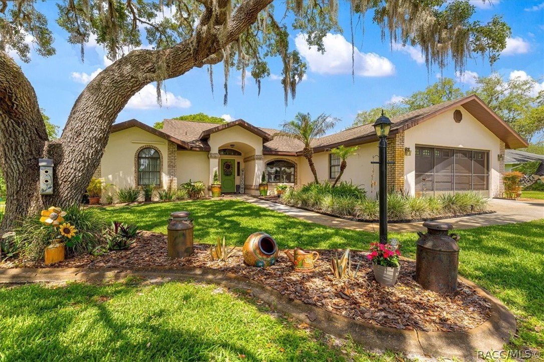 2964 South Cygnet Terrace Inverness, FL 34450 - Photo 66 of 67 a front view of a house with garden