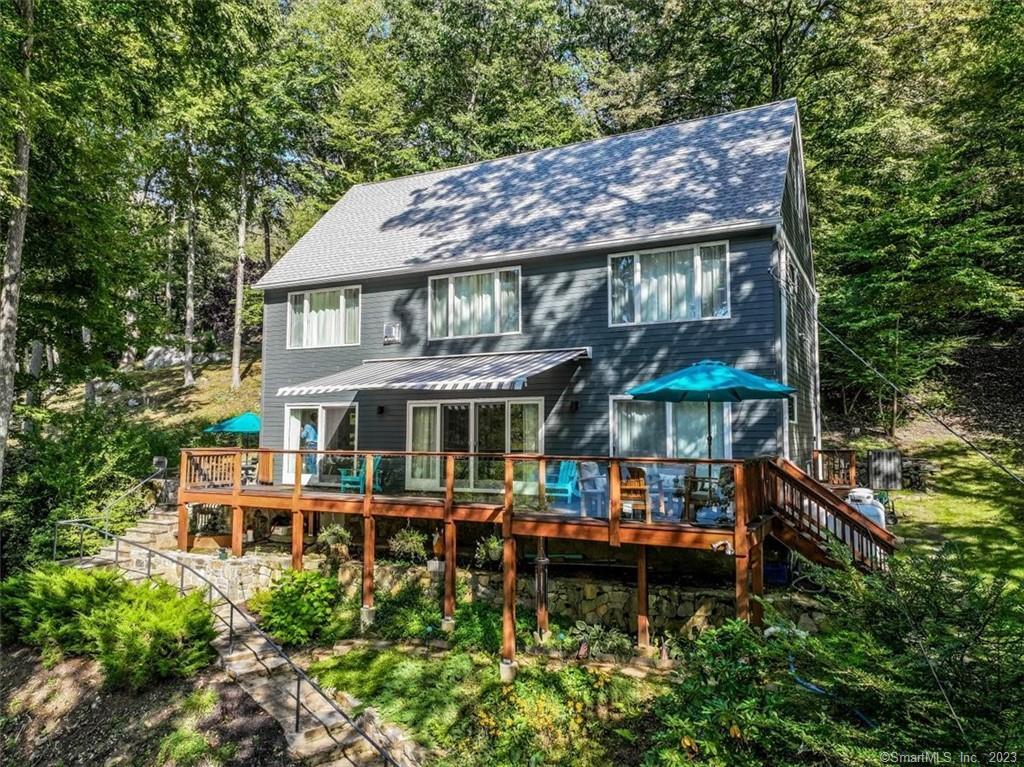 a view of a table and chairs under an umbrella