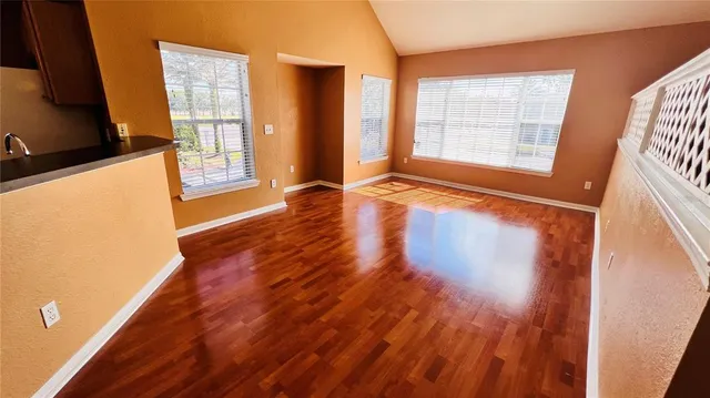 a view of a living room with a wooden floor